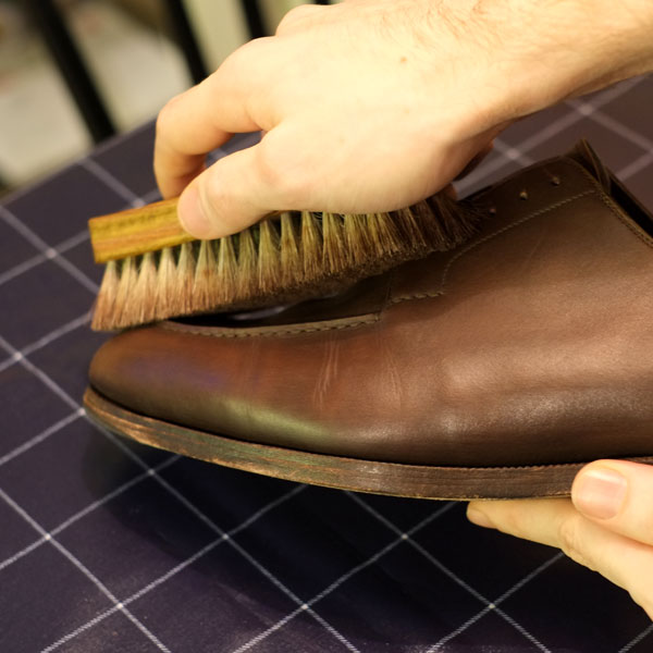 Buff the shoes with a brush to get shine